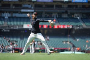 Relief pitcher throwing on outfield line